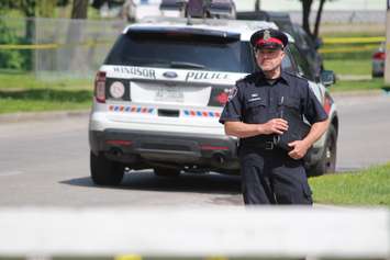 Public Information Officer Sgt. Matthew D'Asti arrives on scene to address the media about an apparent homicide in the 500 block of Brant St., June 4, 2015. (Photo by Jason Viau)