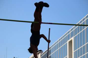 Athletes compete in a pole vaulting competition on Ouellette Ave., May 22, 2015. (Photo by Jason Viau)