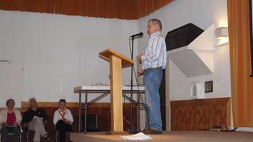 WAIT-PW volunteer Santo Giorno address crowd at Camlachie Community Centre May 26, 2015. (BlackburnNews.com Photo by Briana Carnegie)