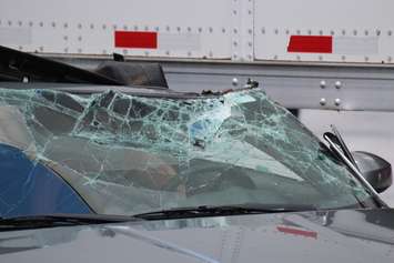 Windsor police investigate a crash involving a transport and a car on Riverside Dr. E and Walker Rd., August 5, 2015. (Photo by Jason Viau)