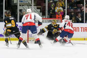 Sarnia Sting goaltender Ben Gaudreau makes a save against the Windsor Spitfires. 26 April 2022. (Metcalfe Photography)