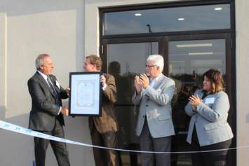 Mayor Randy Hope presenting Christopher Behrens with a Certificate of Recognition, naming Oct. 12 as 