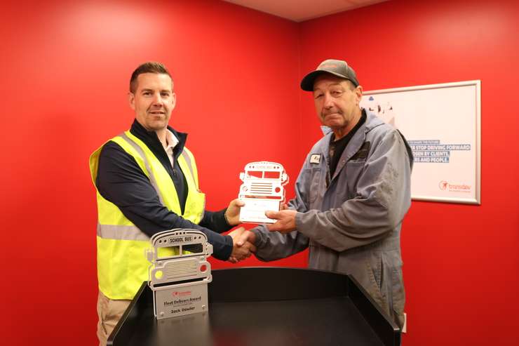 Travis Kelly presenting award to Kevin Dickert. Photo provided by Chuck Archer, Voyago Vice President of Marketing and Communications.