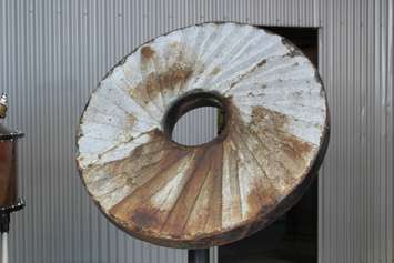 One of the original grind stones used for grain at Hiram Walker & Sons Distillery. It was recently dragged out of the Detroit River, March 22, 2017. (Photo by Mike Vlasveld)