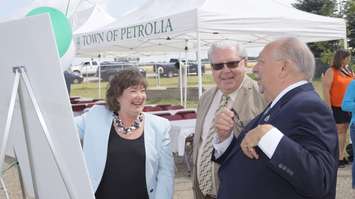 Ontario's Natural Resources and Forestry Minister Kathryn McGarry chats with Petrolia Mayor John McCharles and Sarnia Lambton MPP Bob Bailey at the grand opening of the Mandaumin Reservoir in Plympton-Wyoming. July 14, 2017 (Photo by Melanie Irwin)