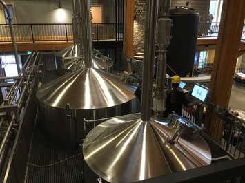 The large vats where beer is brewed, able to be viewed from the bar and dining hall area at Cowbell. August 3rd, 2017 (Photo by Ryan Drury)