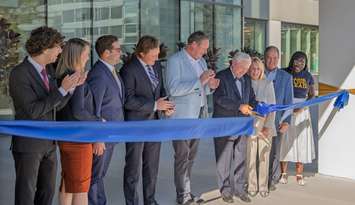 A ribbon-cutting ceremony for the new Rodzik residence hall is held at the University of Windsor, October 6, 2025. From left, Husam Morra, President of the U of W Students’ Alliance, U of W Vice-President of Finance and Operations Gillian Heisz, Michael Kaye and Jack Federer, partners at Tilbury Properties, U of W President and Vice-Chancellor J.J. McMurtry, Don Rodzik Sr., Gail Rodzik, U of W Chancellor Dwight Duncan, and Promys Robinson, Student and Residence Community Assistant. Photo courtesy Kyle Archibald/University of Windsor.