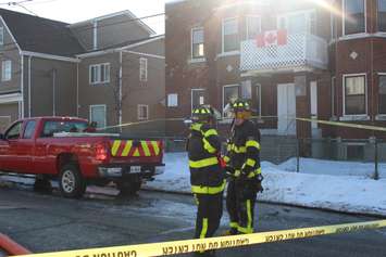 Firefighters at the scene of two house fires in the 800-block of Assumption St. in Windsor March 2, 2015. (Photo by Adelle Loiselle.)