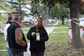 Susan and Bill LaRiviere speak with a neighbour after the house next to their home exploded, October 21, 2015.  (Photo by Adelle Loiselle)