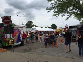 People and classic cars line the streets at the 27th annual Wallaceburg Antique Motor and Boat Outing, August 8, 2015. (Photo by the Blackburn Radio Summer Patrol)