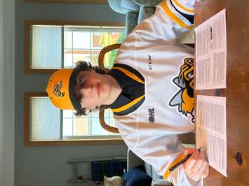 Lane Sim signs an OHL contract with the Sarnia Sting (Photo courtesy of Sarnia Sting)