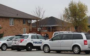 Windsor police ESU surround house in east Windsor to serve an outstanding arrest warrant, December 1, 2015. (Photo by Maureen Revait) 

