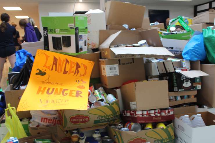 Boxes of food stacked up at Ursuline College Chatham after the Lancer's Scare Hunger food drive. November 5, 2024. (Photo by Matt Weverink)