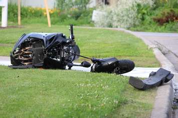 A motorcycle driver has been taken to hospital after colliding with a car on Riverside Dr. W at Askin Ave., June 19, 2015. (Photo by Jason Viau)