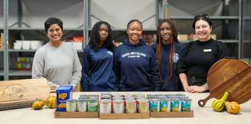 Lisa Harnarine, Principal, Ursuline College; Ciara Taylor, Grade 12 Student; Maria Angus, Grade 12 Student; Kinfe Atoybi, Grade 11 Student; and Coral Hoekstra, Chatham Outreach for Hunger (Image courtesy of the St. Clair Catholic District School Board)