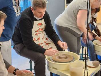 Lambton College President Rob Kardas tries his hand at pottery during the Celebrity Bowl-a-Thon - Feb 13/23 (Blackburn Media Photo by Josh Boyce)