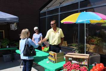 Vendors take part in a Farmers Market outside the Civic Centre in Chatham to kick off Local Food Week. June 6, 2016. (Photo by Matt Weverink)