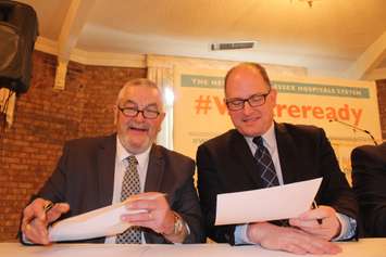 Essex County Warden Tom Bain and Windsor Mayor Drew Dilkens sign a letter to Health Minister Dr. Eric Hoskins January 25, 2016. (Photo by Adelle Loiselle)