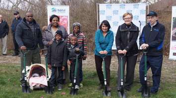 The Tshangala family poses for a picture with Lambton County and Habitat representatives to celebrate the ground breaking of their new home on Devine St. April 13, 2016 (BlackburnNews.com Photo by Briana Carnegie)