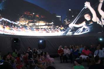 An audience watches as images from the film Horizon are shown on a 360 screen in the SesquiDome in Windsor on July 7, 2017. Photo by Mark Brown/Blackburn News)