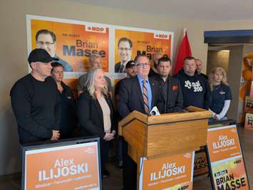 NDP candidate for Windsor West Brian Masse discusses the party's plan to fight US tariffs, accompanied by union members and from left, Unifor Local 200 President John D'Agnolo, Windsor West MPP Lisa Gretzky, and NDP candidate for Windsor-Tecumseh-Lakeshore Alex Ilijoski, on April 3, 2025. Photo by Mark Brown/WindsorNewsToday.ca.