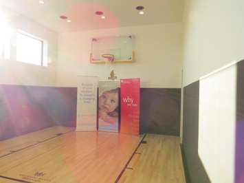 The indoor basketball court in the basement at the Dream Lottery home at 2074 Ironwood Rd. (Photo by Miranda Chant, Blackburn News)