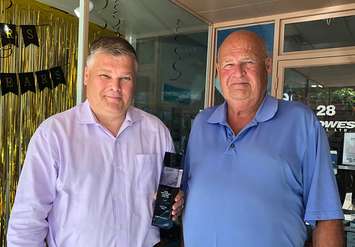 Rob and Sam Blowes, outside Stratford office, with 2018 CWT Canada Associate of the Year award. (photo submitted)