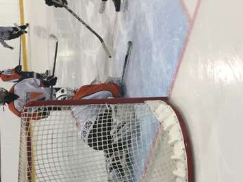 Drayton goalie covers the puck. (Photo by Marty Thompson)