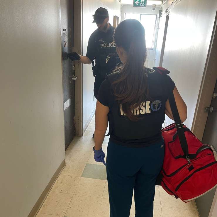 A Windsor police officer and a nurse visit an apartment building on Glengarry Avenue. Photo courtesy Windsor Police Service/X