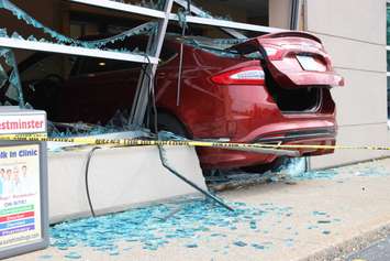 Emergency crews respond to a walk-in clinic on Tecumseh Rd. E after a car smashes through the front window, June 8, 2015. (Photo by Jason Viau)