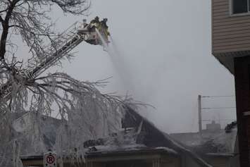Windsor fire crews battle a blaze in the 700-block of Windsor Ave., February 18, 2015. (Photo by Roy Kang)