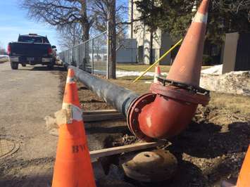 A watermain near the water plant in Chatham along Grand Ave. E receives repairs on March 12, 2015. (Photo by Ricardo Veneza)
