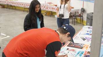 Michael Marinaro signs an autograph for a young figure skater during a meet-and-greet at the Point Edward Arena. June 3, 2018. (Photo by Colin Gowdy, BlackburnNews)