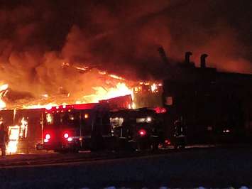 Fire crews battle a factory fire on Arnold St. in Wallaceburg, December 29, 2017. (Photo courtesy of Scott Ramey via Twitter)