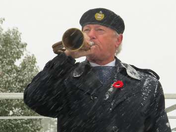 David Cunningham plays the Last Post on same bugle his grandfather played in Vimy Ridge. (Photo by Miranda Chant, Blackburn News)