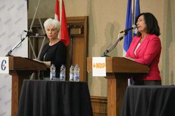 Windsor-Tecumseh Conservative candidate Jo-Anne Gignac, left and NDP Cheryl Hardcastle speak during a debate, September 30, 2015. (Photo by Jason Viau)