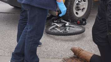 Bicycle trapped under the wheel of a van in London Rd collision. October 13, 2015 (BlackburnNews.com Photo by Briana Carnegie)