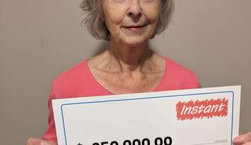 Lucia Demelo of Ilderton and her $250K Instant prize. Photo supplied by OLG. 