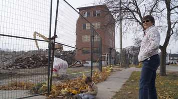 Three-year-old Corban Burn with grandma Cathy Vanni waiting for the last piece of the old Sarnia General Hospital to fall. November 12, 2018. (Photo by Colin Gowdy, BlackburnNews)
