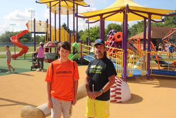 Peter Best of the Windsor Accessibility Advisory Committee, right, and Logan Best at the Farrow Riverside Miracle Park in Windsor, August 7, 2019. Photo by Mark Brown/Blackburn News.