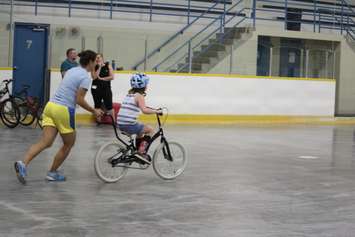Addison riding her first two-wheel bike at the iCan Bike Camp in Chatham. July 13, 2016. (Photo by Natalia Vega)