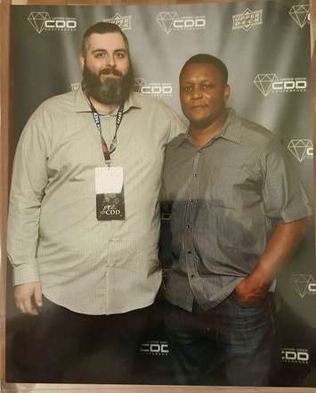 Rockets Sports Cards owner Mike Lucio 
meeting former football running back Barry Sanders at the Upper Deck 2018 Certified Diamond Dealer Conference. (Photo courtesy of Mike Lucio). 
