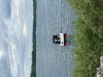 First responders search the water of Conestogo Lake Sunday afternoon for a man who went missing while swimming. His body was recovered Sunday evening. Photo by Nathan Marshall