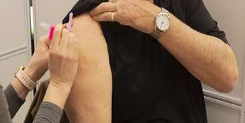 A public health nurse administers a COVID-19 vaccine. (File photo supplied by Southwestern Public Health)