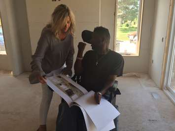 Designs for the Bluewater Health Foundation 2018 dream home are shown to Foundation Board Member Dan Edwards. August 8, 2017 (Photo by Melanie Irwin)