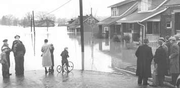 Residents survey the damage from the flood of 1937 in London. Photo courtesy of the Upper Thames River Conservation Authority.