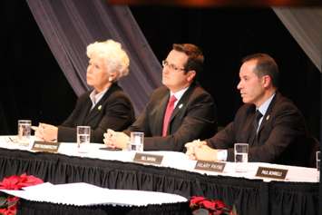 Windsor City Councillors Jo-Anne Gignac, Irek Kusmierczyk and Bill Marra listen to Mayor Drew Dilkens deliver his inaugural address, December 1, 2014. (photo by Mike Vlasveld)