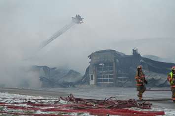 Smoke still rises from ruins  (blackburnnews.com photo)