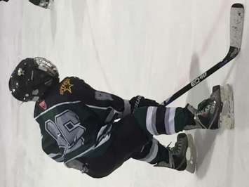 A Twin-Centre defenceman lines up for the faceoff. (Photo by Marty Thompson)