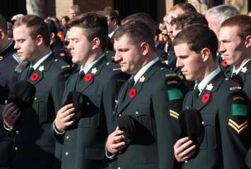Members of the Canadian military stand in honour of fallen Canadian soldiers at the cenotaph in Windsor, November 11, 2014. (photo by Mike Vlasveld)